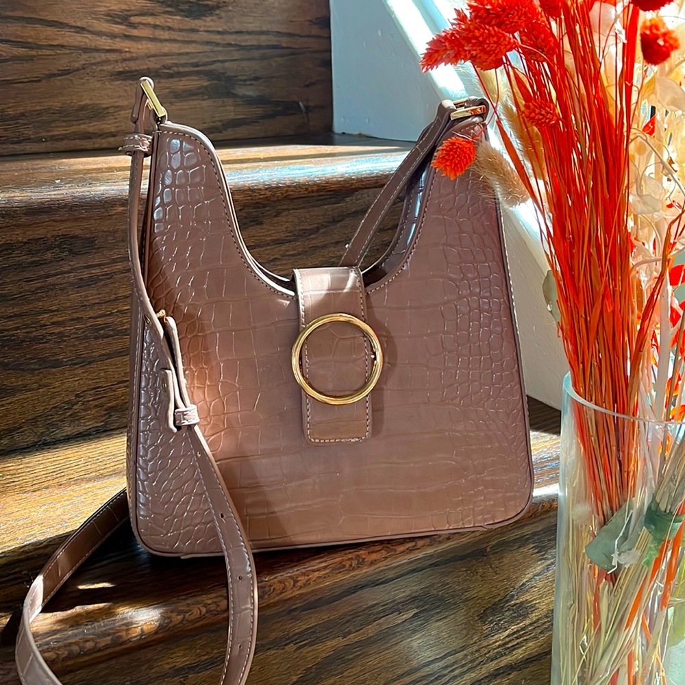 Madison West purse in tan snake skin with adjustable strap.Never used,no flaws.